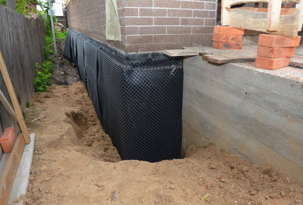 Happy homeowners after waterproofing job in Rolling Prairie